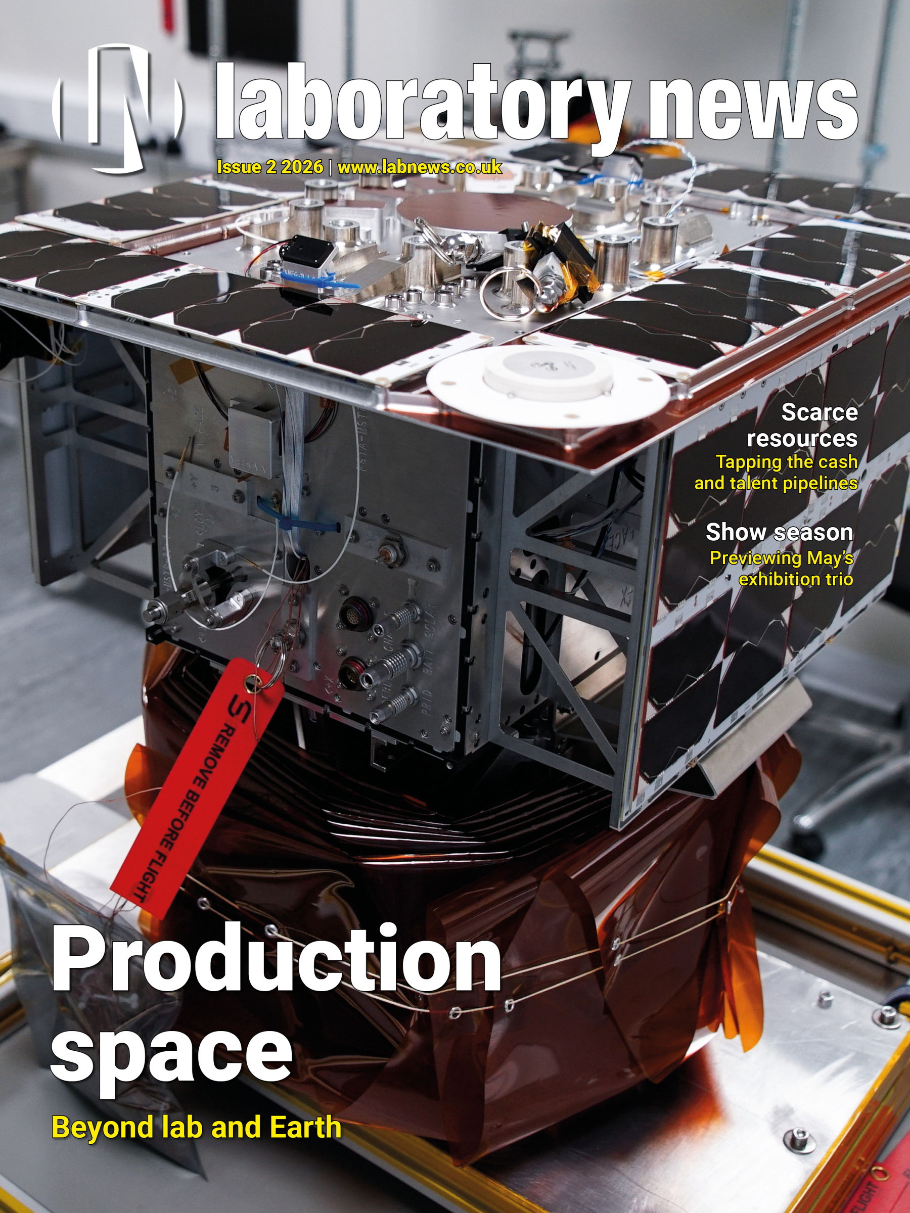 Front cover of Laboratory News featuring a satellite component in a lab setting with the headline "Production space: Beyond lab and Earth"