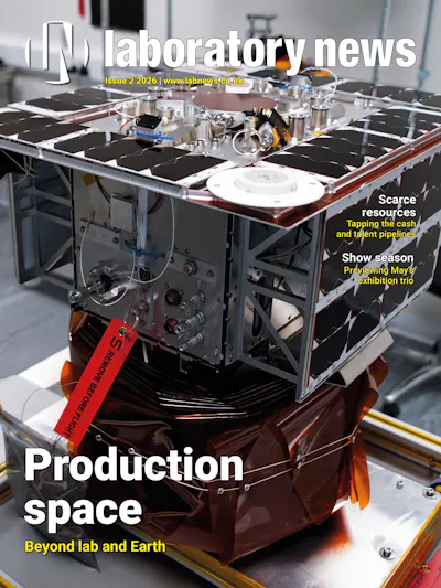 Front cover of Laboratory News featuring a satellite component in a lab setting with the headline "Production space: Beyond lab and Earth"
