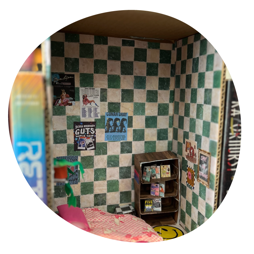 A miniature model room hand-crafted with paper, cardboard and fabric.