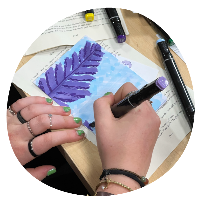 Email Image: A person with green nail polish drawing with a texta.