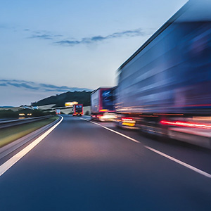 Trucks going down a highway