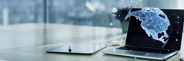 Construction workers having discussion over laptop