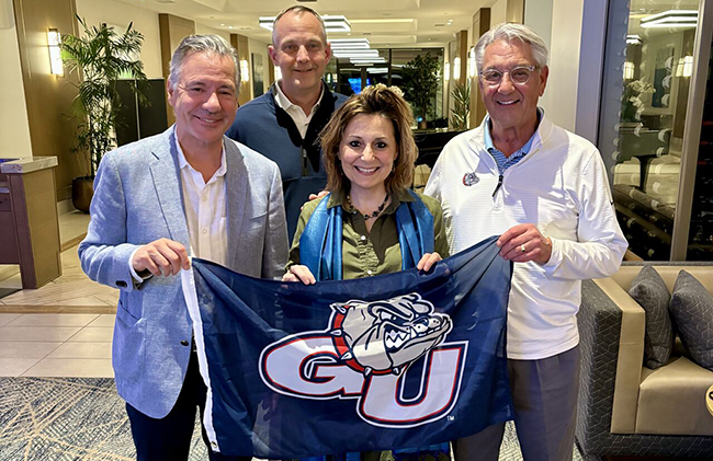 Professor John Collet, Kyle Sweeney, Michael Hanrahan, Natalie Keller, and Madylin Campbell pose for a photo with the Super Bowl LX logo