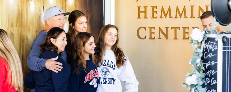 Families take group photos in the Hemmingson Center
