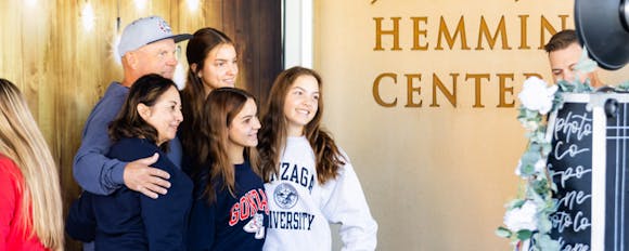 Families take group photos in the Hemmingson Center