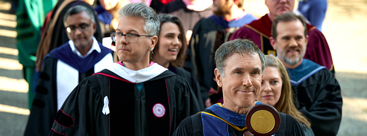 Faculty enter St. Aloysius church during the procession for the Mass of the Holy Spirit.