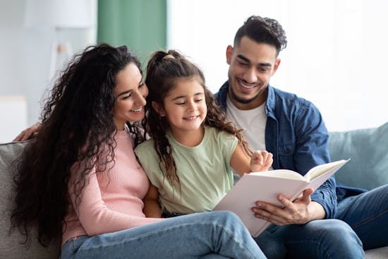 Mom, Dad and child reading
