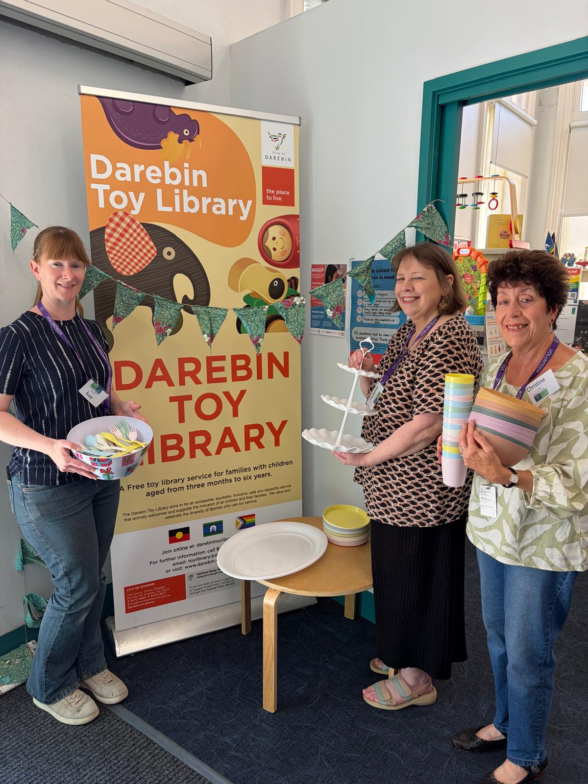 Toy library volunteers posing with the new party kits