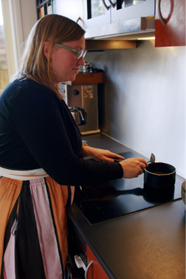 Image of a person using induction cooktop