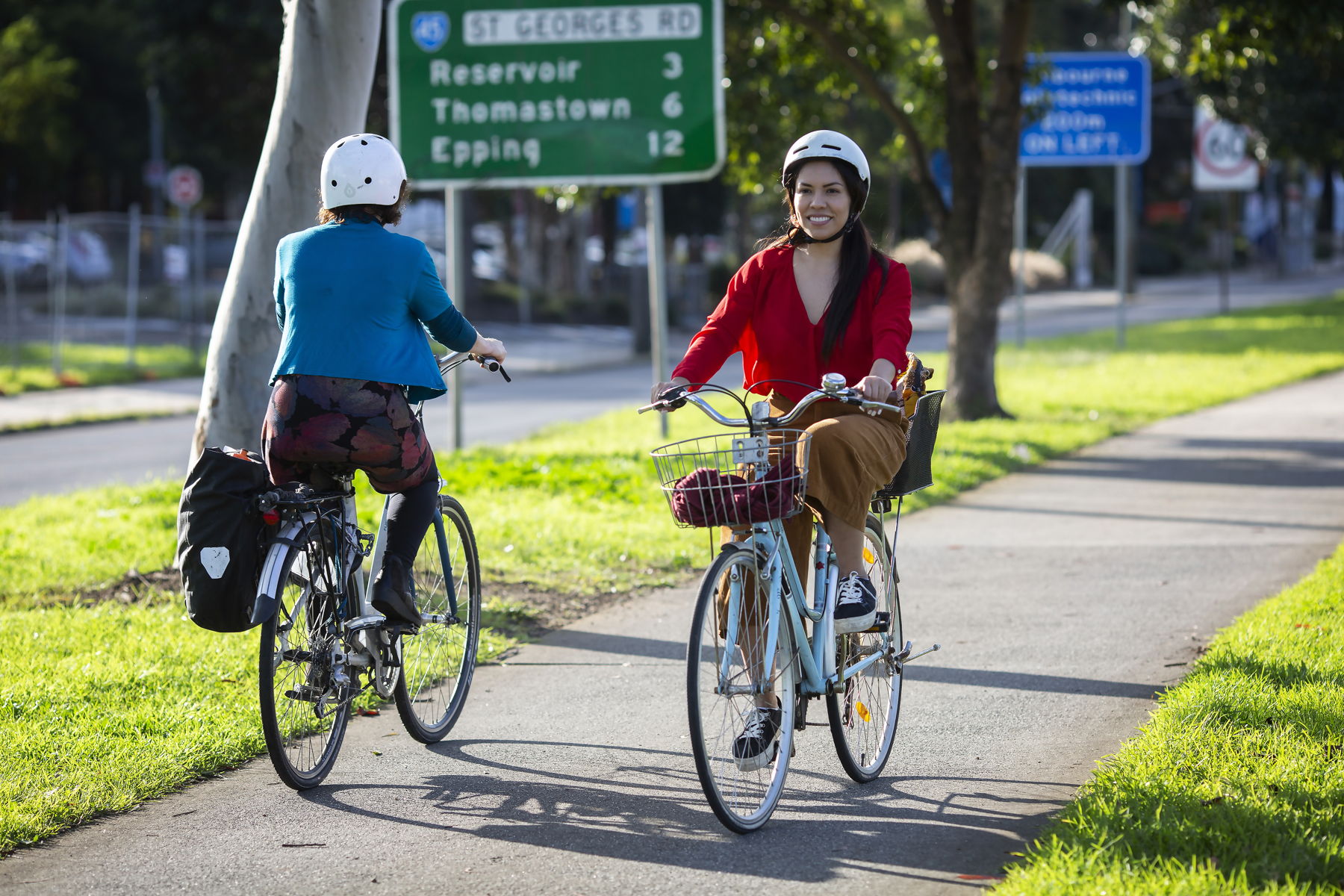 Woman riding her bicycle down a shared path