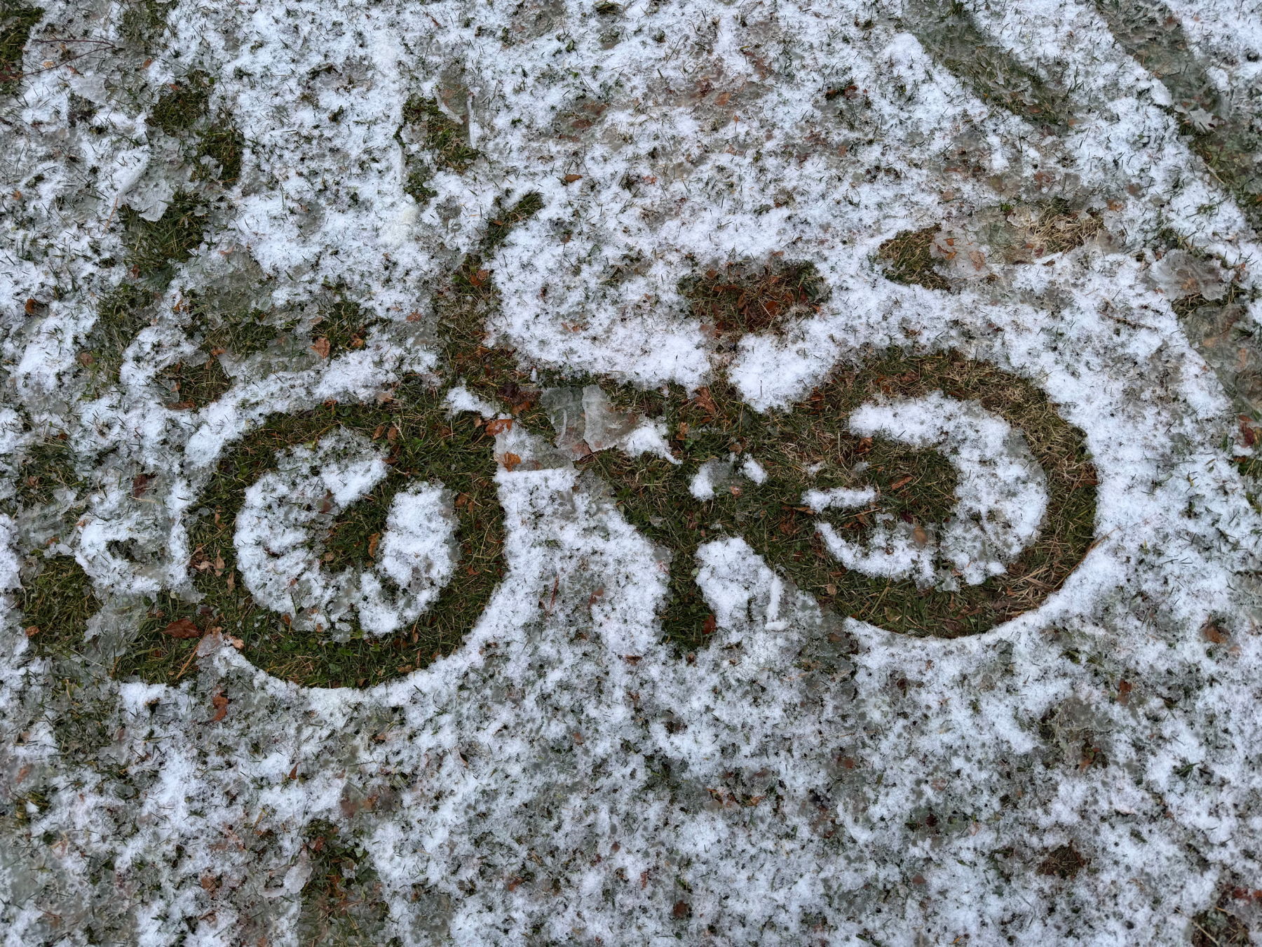 outline of bicycle in the snow