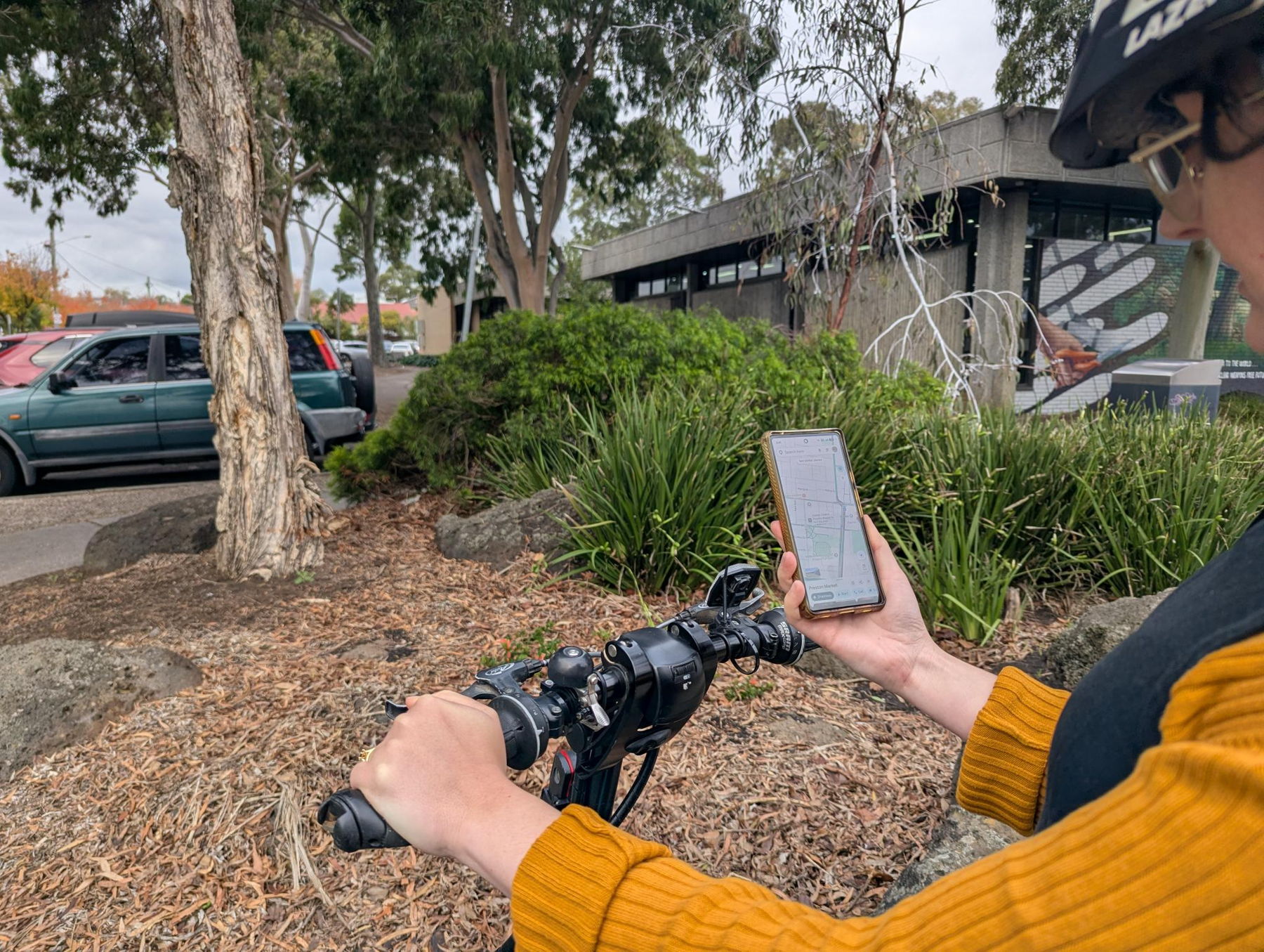 Person checking a maps app before setting off on their journey