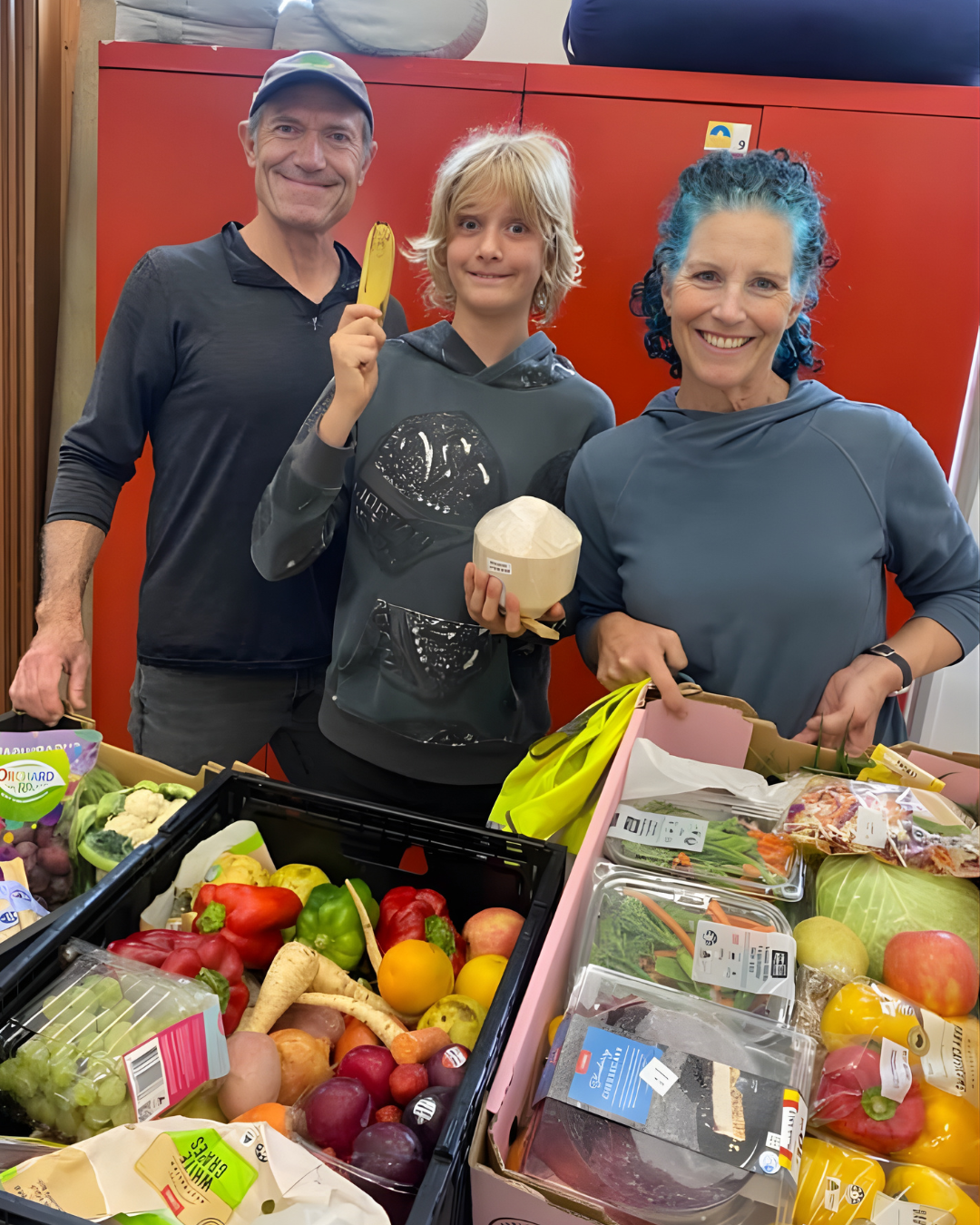 A group of people posing with rescued food