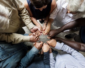 Stock photo of people in a circle holding hands