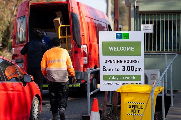 Photo of Darebin Resource Recovery Centre where a person is unloading the contents of their van for inspection