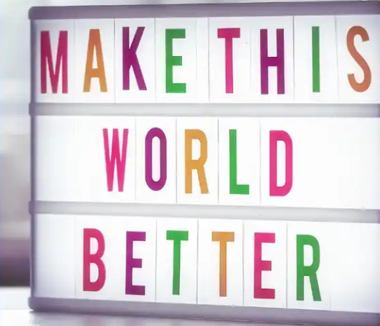 sign that says make this world better