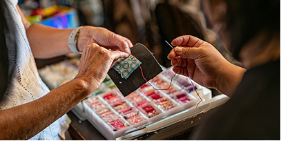person weaving visible patches